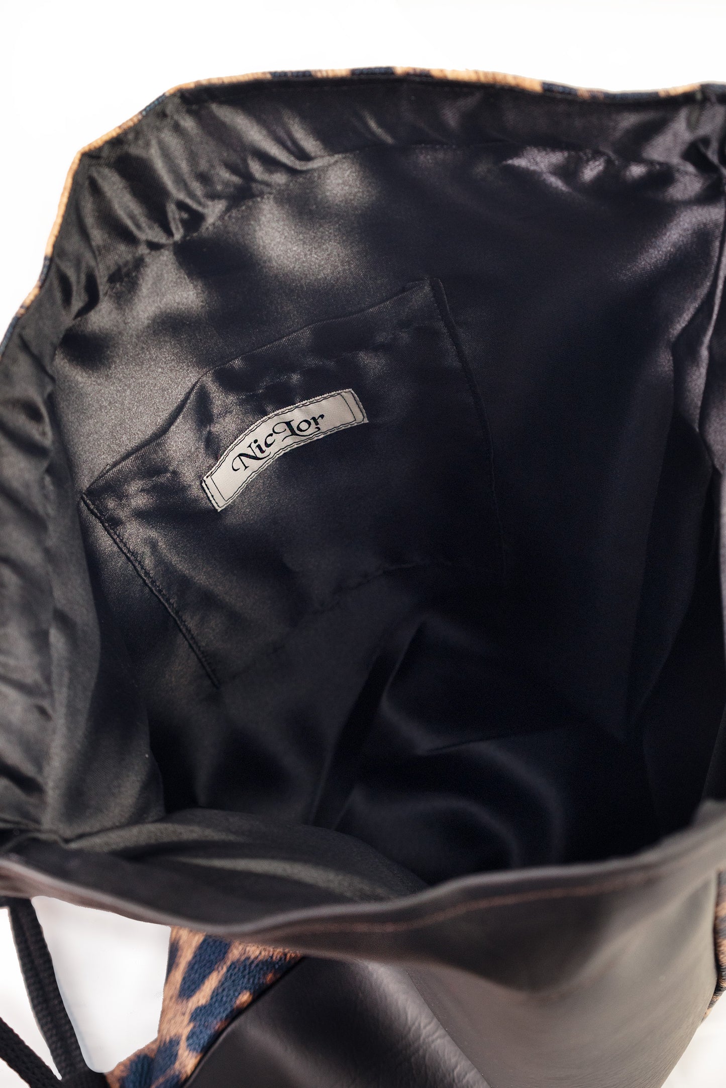 Vegan Leather Two-Tone Leopard Print Drawstring Backpack